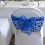 Organza sash tied in a sophisticated bow to adorn the back of your chair