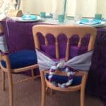 Peacock colours in your sashes to created a unusual chair decor.