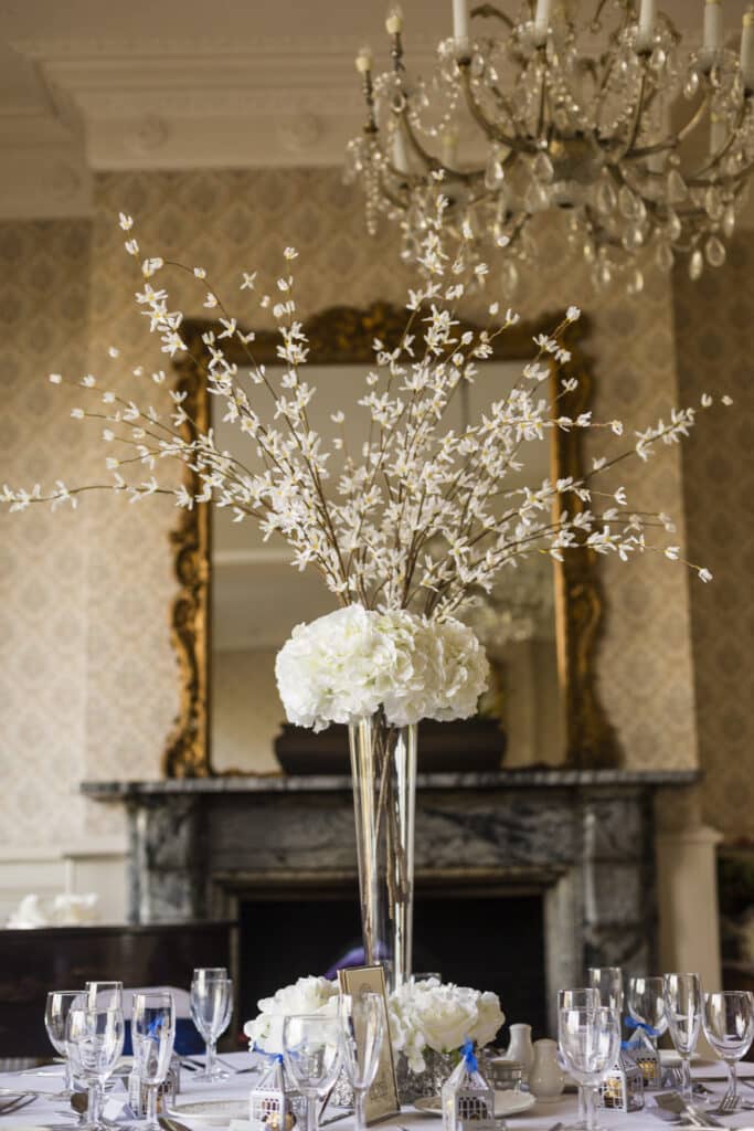 Tapered Glass Vase with Hydrangea and Forsythia. The perfect centrepiece for a 20's inspired venue decor