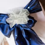 Chair decor of blue sequinned taffeta and tulle adornment