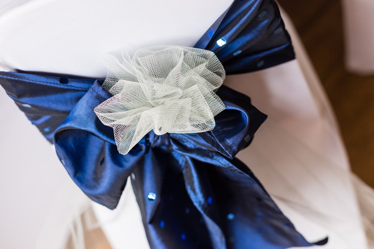 Chair decor of blue sequinned taffeta and tulle adornment