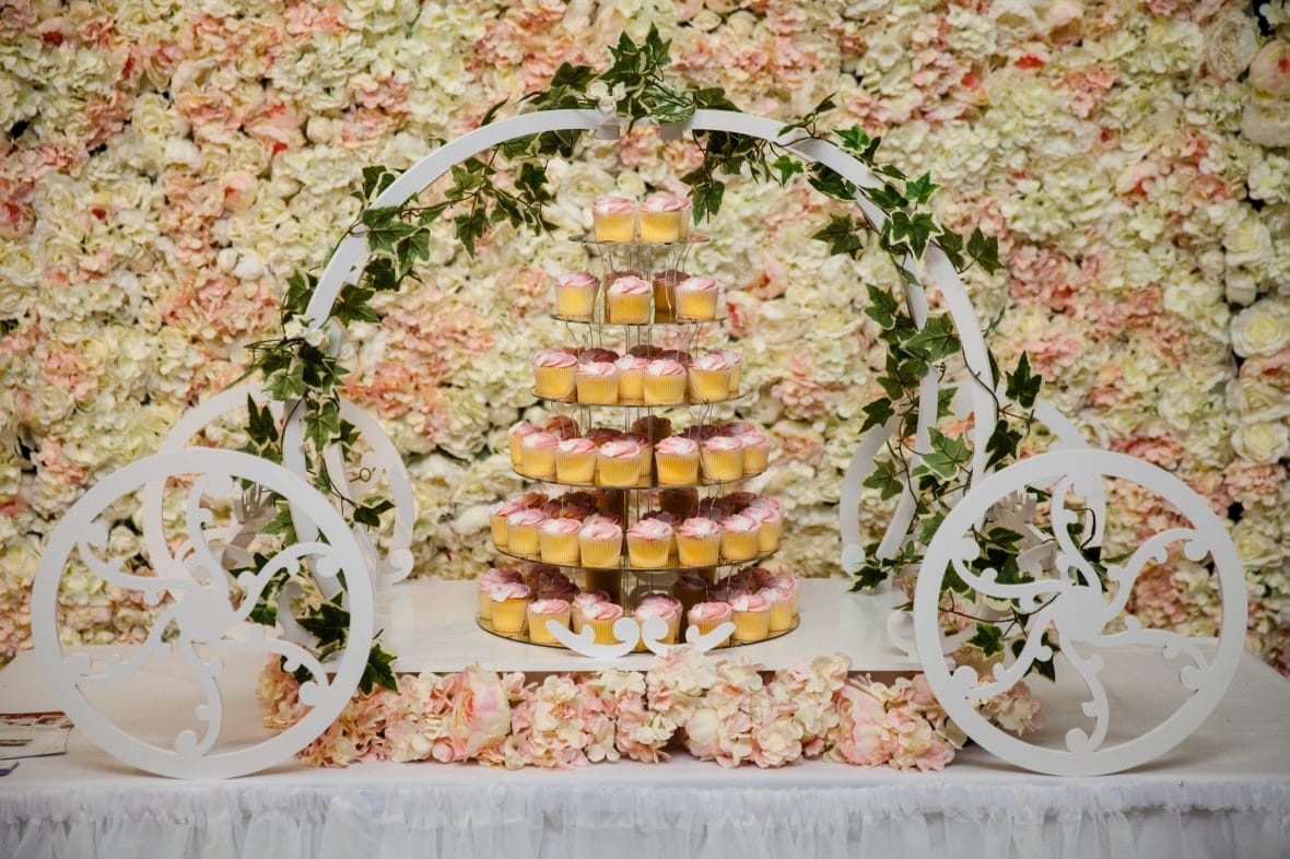 Flower wall and Cinderella Carriage Cake Display