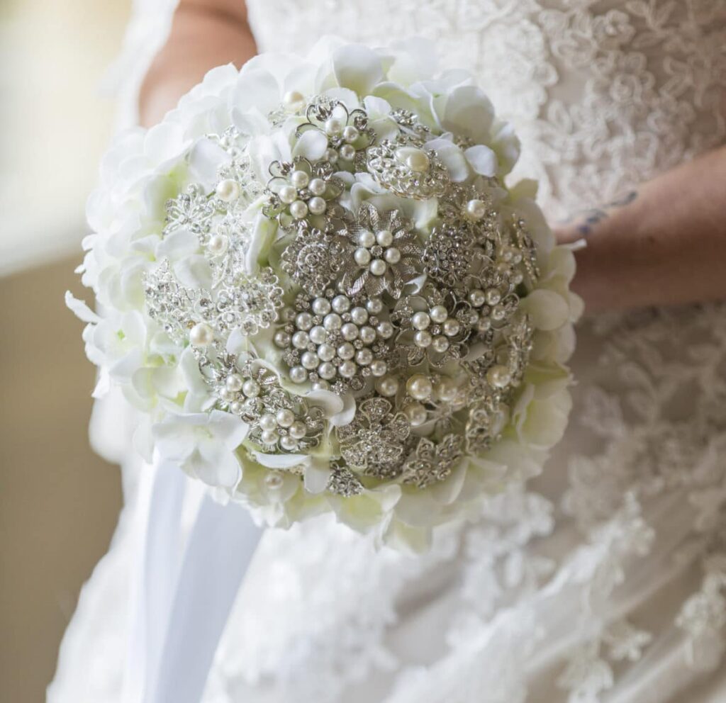 A gorgeous brooch bouquet with silver toned brooches- Fabulous Functions UK