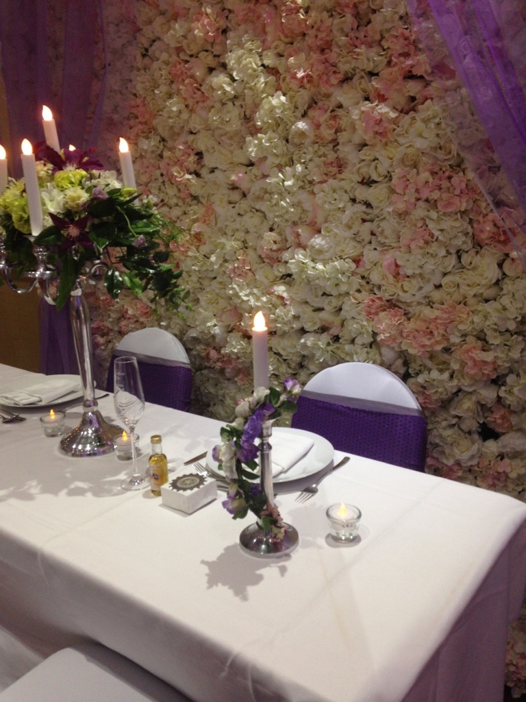 Silver toned candle sticks with entwined flowers