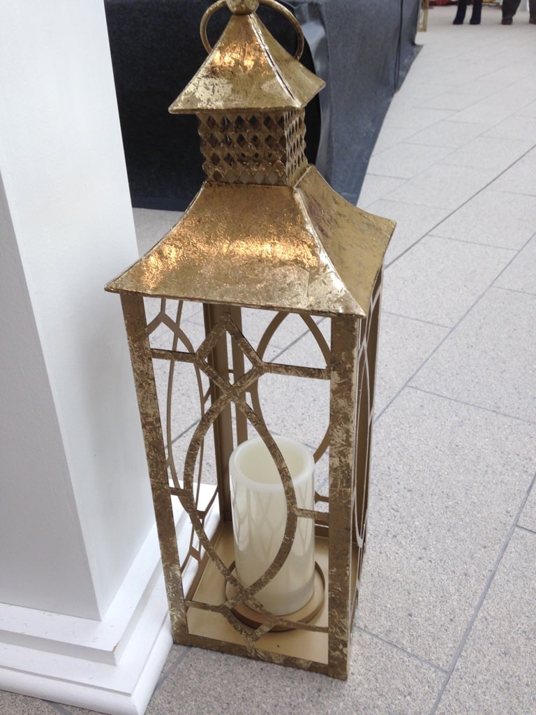 Gold toned lantern available to hire from Fabulous Functions UK
