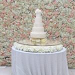 acrylic wedding cake table with sequinned table linen