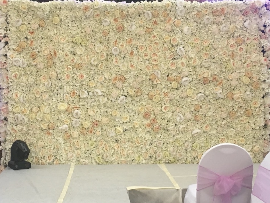 Floralie- Cream toned silk flower wall all setup for a catwalk show at Chelsea Old Town Hall