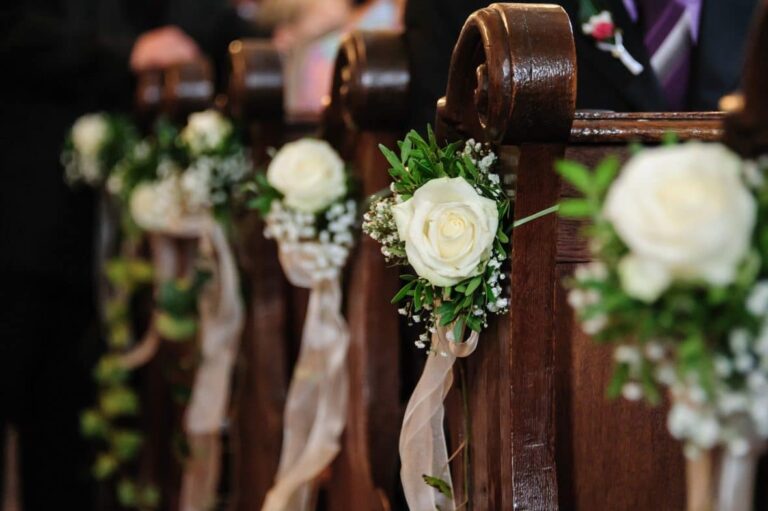 A Marriage Law Shake-Up - wooden church pews with flower decorations