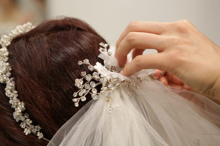 Bride having veil pinned to her hair - wedding traditions from around the world