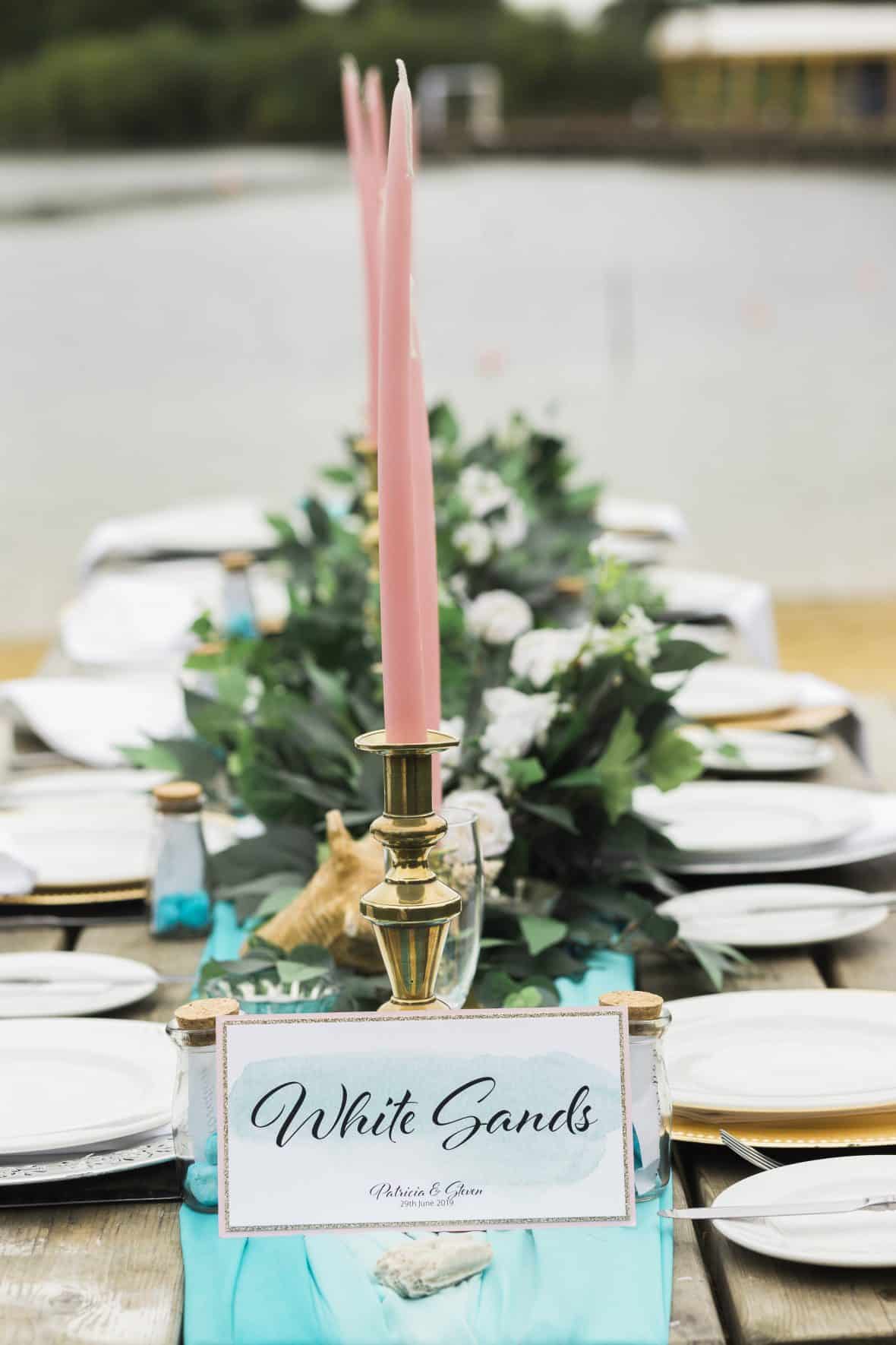 Pink tapered candles and brass candelsticks