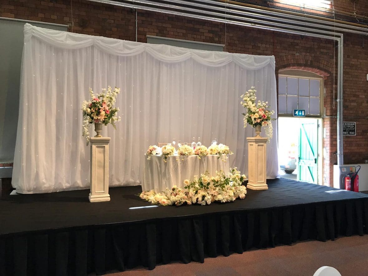 Fabulous Functions UK created a gorgeous wedding staging created at the Steam Museum in Swindon. The staging included a sweetheart table for two.