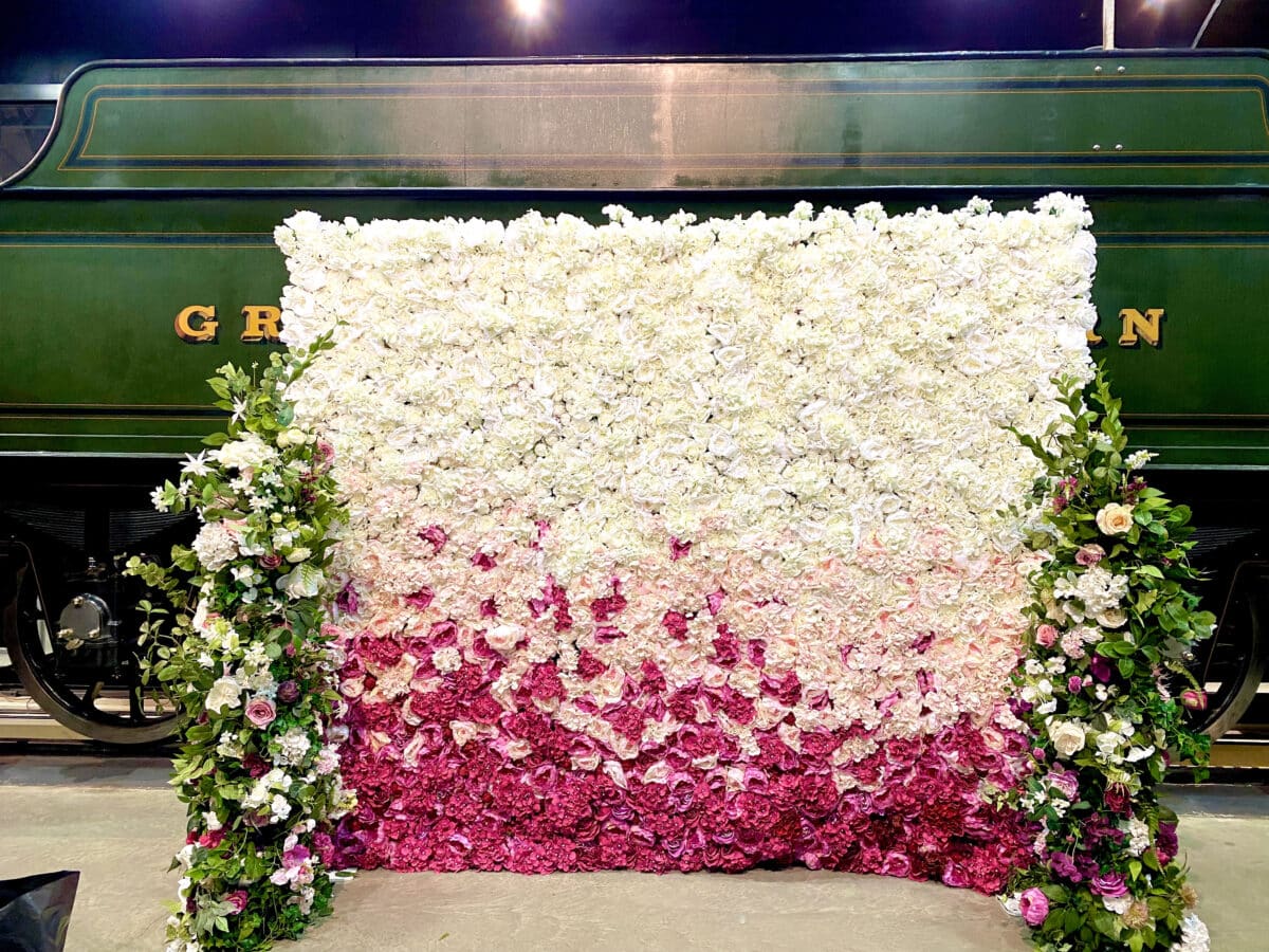 Pink to white ombre flower wall wedding backdrop from Fabulous Functions UK