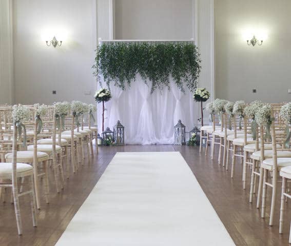 Floral curtains: gorgeous pleated white curtains topped with a pelmet of greenery or blossoms.