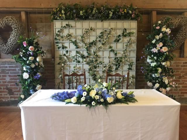 Frame a table with a pair of floral columns such as this. Fabulous functions backdrop range