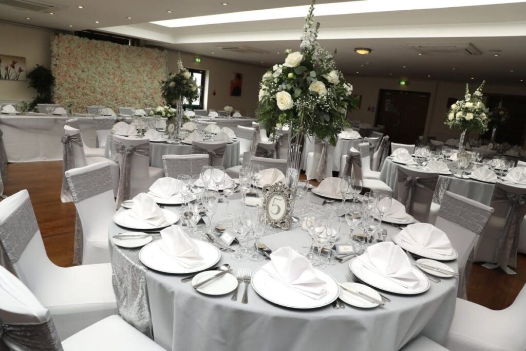 White charger plates with a diamante rim available from venue stylist and accessory hire Fabulous Functions UK - A Silver & Grey Theme