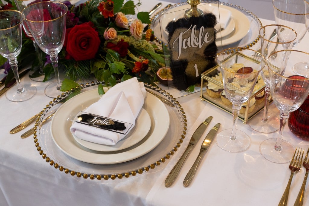 An Ombre-themed Wedding with gold edged glass charger platesPhotoshoot - table place setting