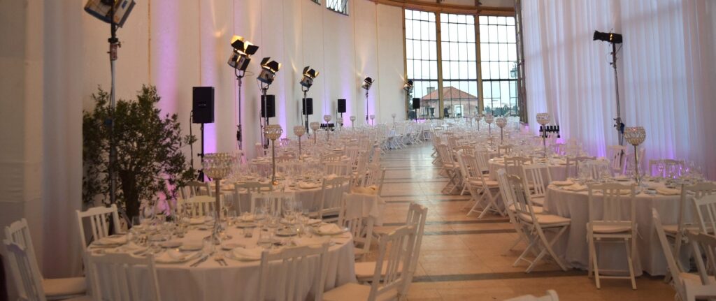 Do Suppliers Charge More for Weddings?  - room set up for a wedding with an all white theme.