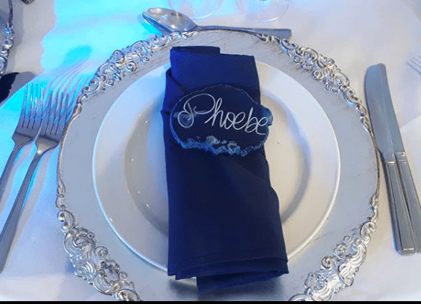 Add a touch of Classic Blue with a blue napkin arranged on a silver charger plate and add Agate Slices  for your guest place names.