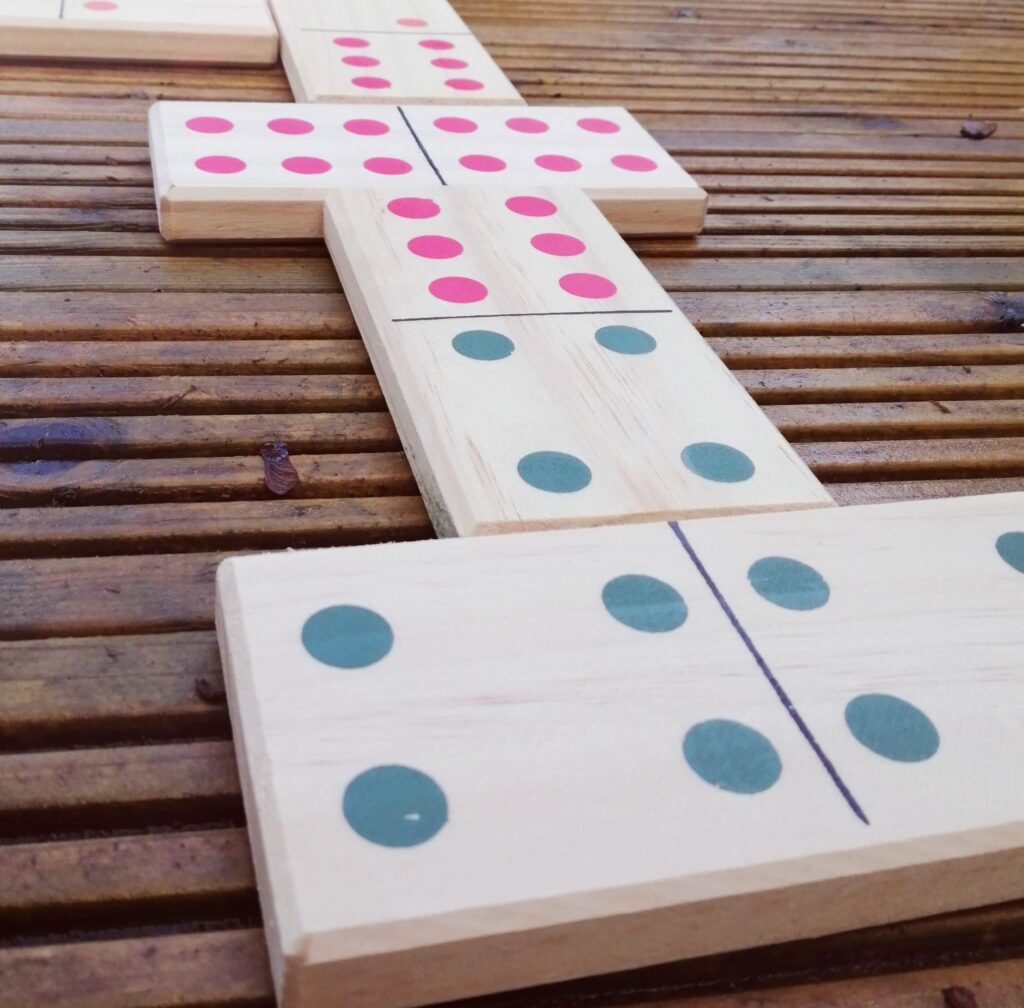 Giant dominoes on wooden decking - giant garden games for hire