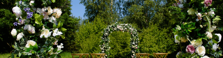 Creating a fabulous setting for an intimate wedding setting. Cross back chairs and a gorgeous floral arch makes the setting perfect for an intimate outdoor ceremony - Fabulous Functions UK created this gorgeous setting.