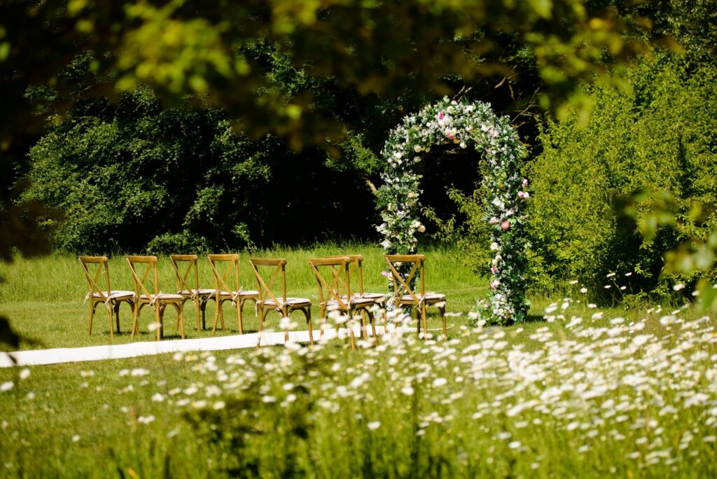 Create a gorgeous space for your wedding ceremony with this lush floral arch backdrop created by Fabulous Functions UK