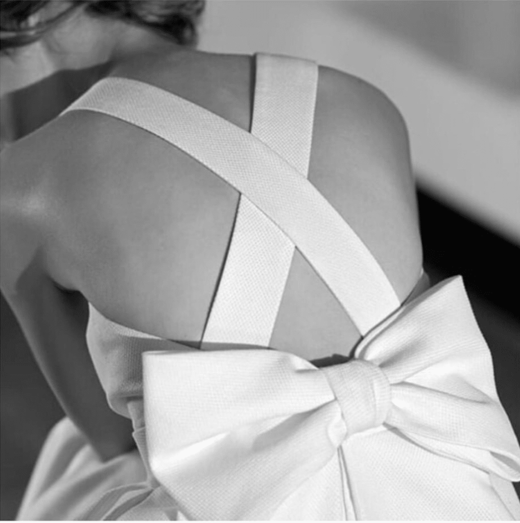 Wedding dress with bow feature on the back. As seen on the instagram of bridal boutique @willoughbyandwolf