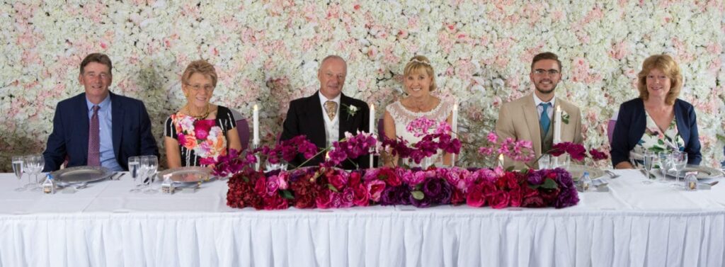 Silk Flower Wall - flower wall at a wedding at Wrag Barn golf club