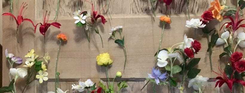 Are Budget Wedding Backdrops Cost Effective? - Flowers on wire forming a curtain.