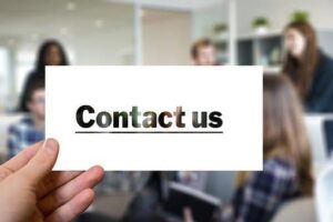 Contact Us - graphic with blurred people in the background.