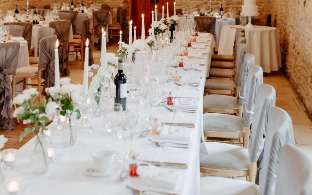 Amy and Jerrad's  Kingscote Barn Wedding - table setting at Kingscote 
Barn 