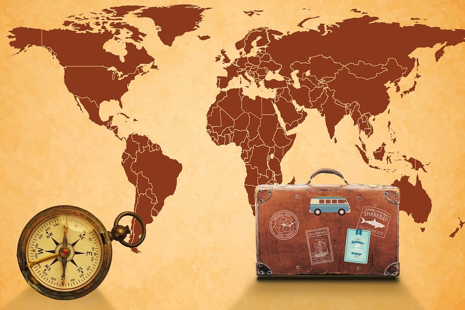 vintage suitcases - map of the world and compass