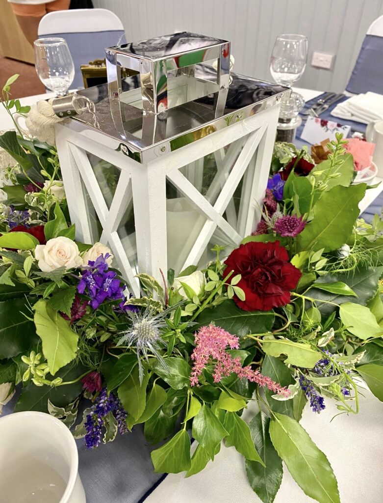 Fresh flowers for this floral ring centrepiece for a wedding breakfast