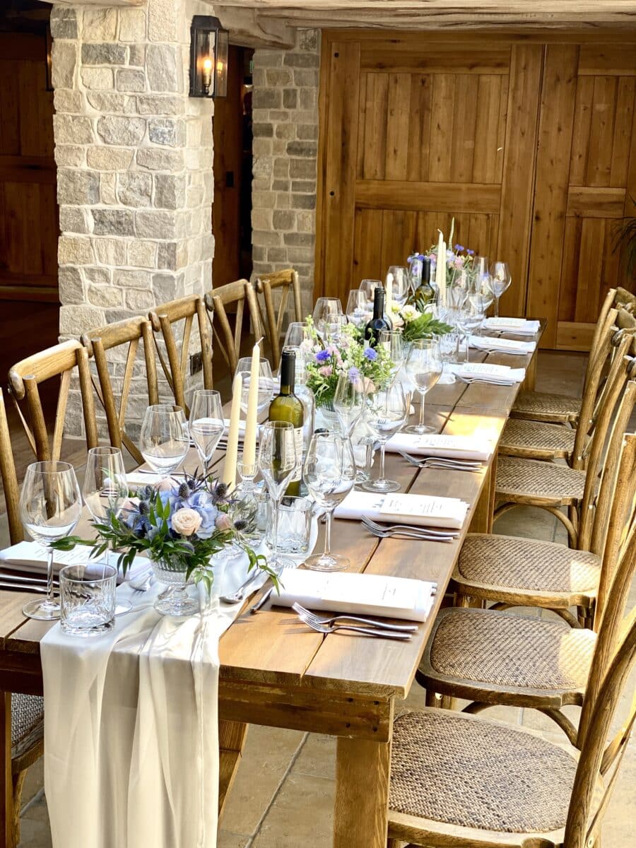 Small glass vases filled with fresh florals for this summer wedding in Cirencester. Each vase held a different design adding to the final beauty of the banquet style setting