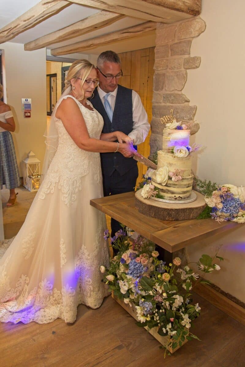 Cake cutting ceremony for Sue and Steve at the Crown at Ampney Brook Cirencester 