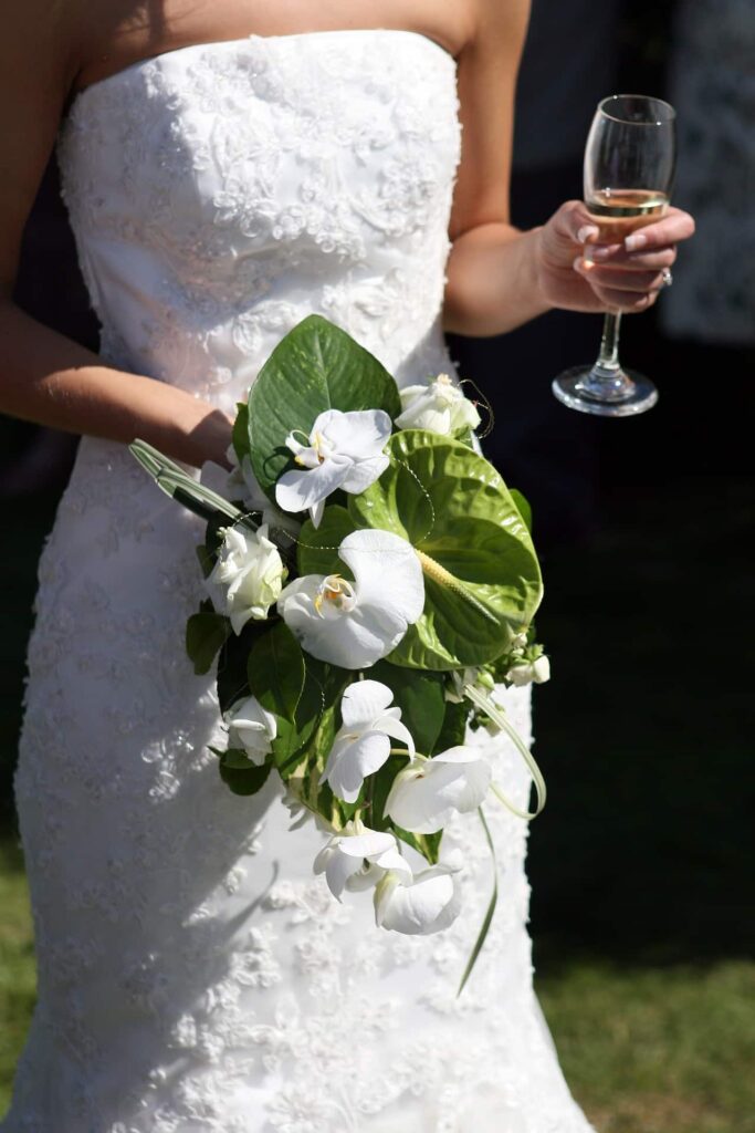 Cascade or teardrop wedding bouquet incorporating greenery and florals. The shape flows towards the floor and can be as long as you like.