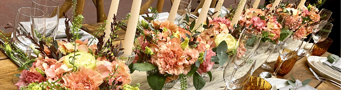 Wedding Flowers centrepiece created in small vases - Fabulous Functions UK