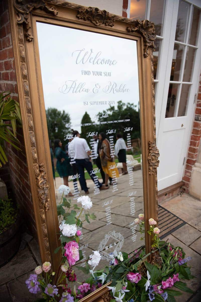 A mirrored table plan is a statement piece of wedding decor hire