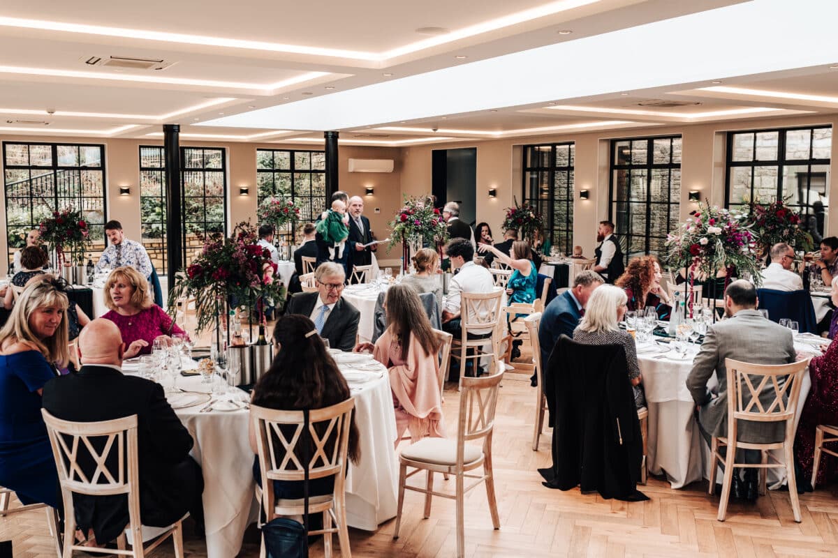 A fuchsia and forest green colour palette for this wedding breakfast at the Peartree at Purton