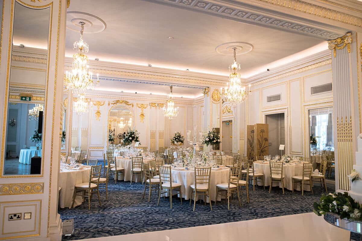 Green and White wedding flowers colour palette for this Wedding breakfast setting at the Mandarin Oriental Hotel Hyde Park London.