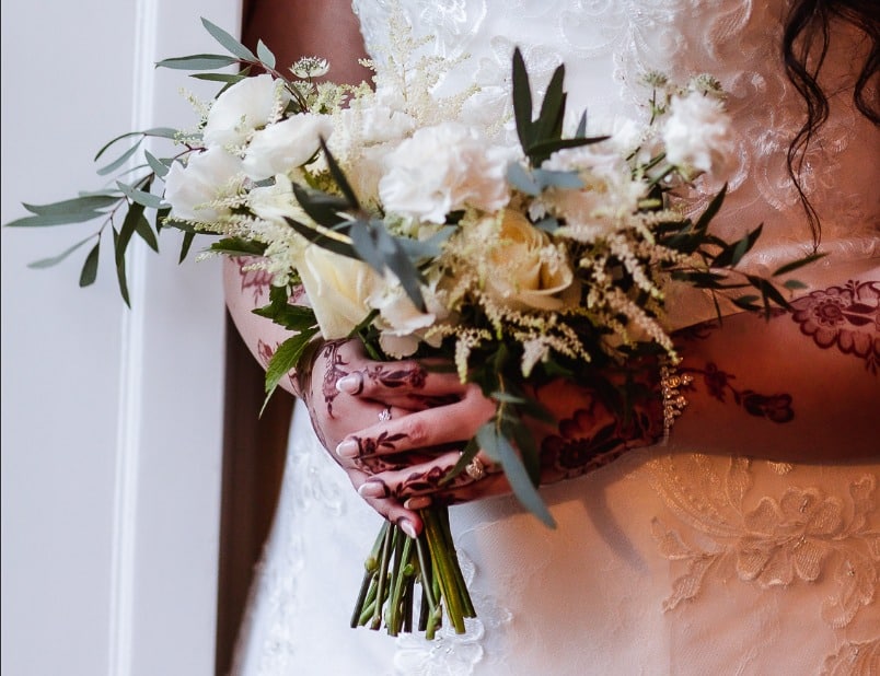 You have a choice of three wedding flowers packages. This is an Asymmetric bridal bouquet of roses and foliage by Fabulous Functions UK.