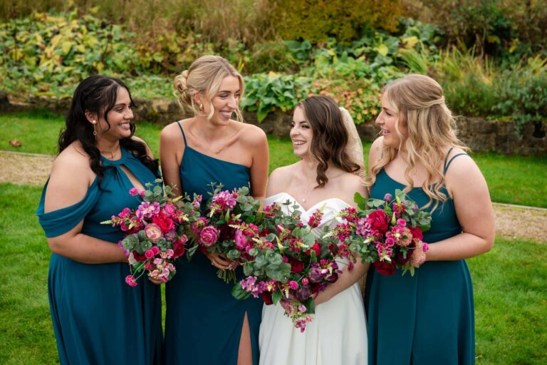 Burgundy and fuchsia wedding florals featured in this burgundy and teal wedding colour palette for a Pear Tree Purton Wedding