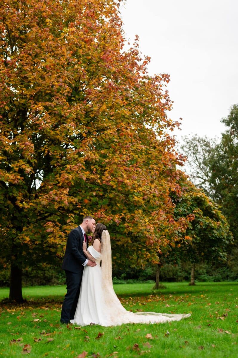 Jenna wears her chapel length veil for her wedding at the Pear Tree Purton Wedding Venue