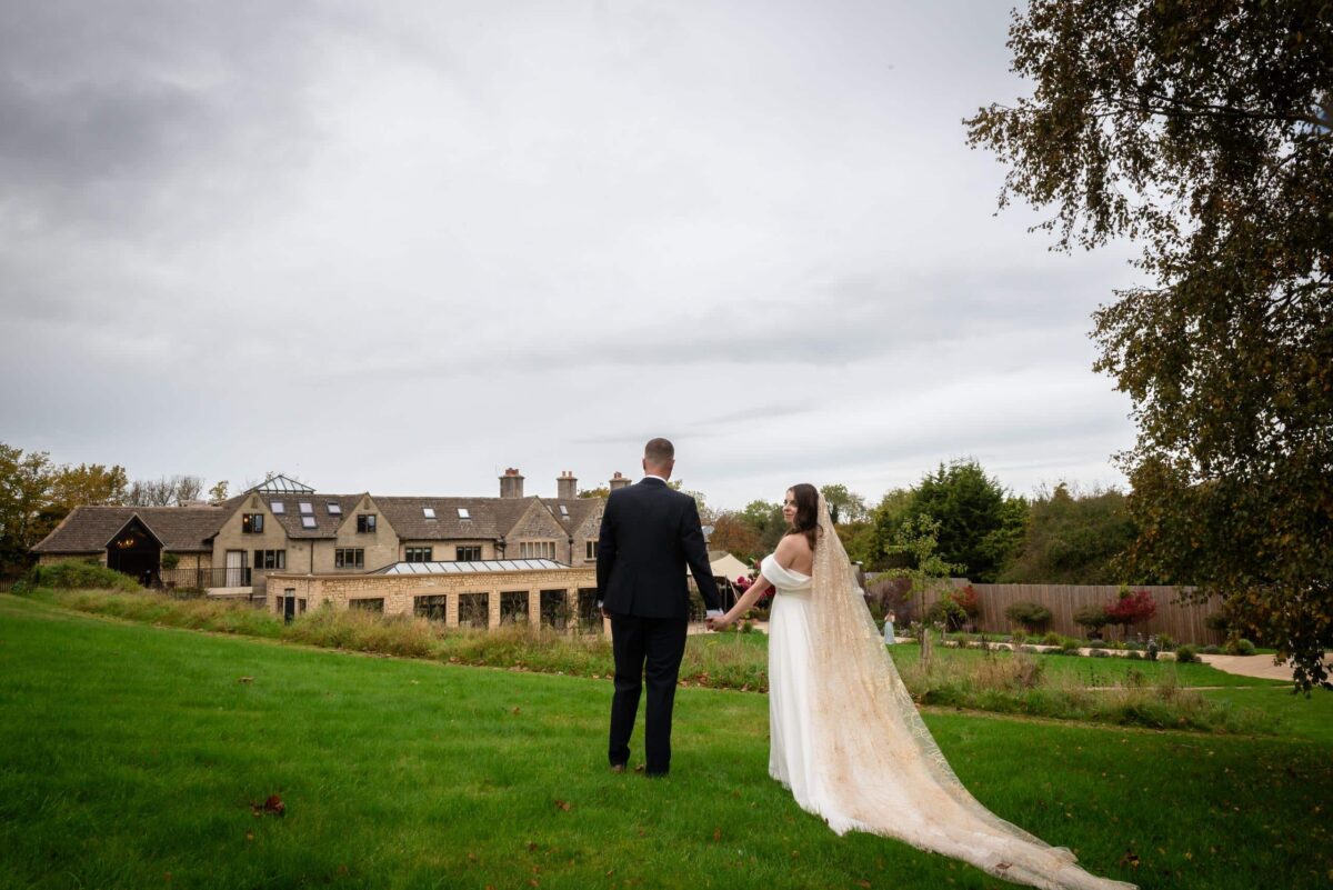 Burgundy and Teal Wedding theme with the bride wearing a soft tulle chapel length veil