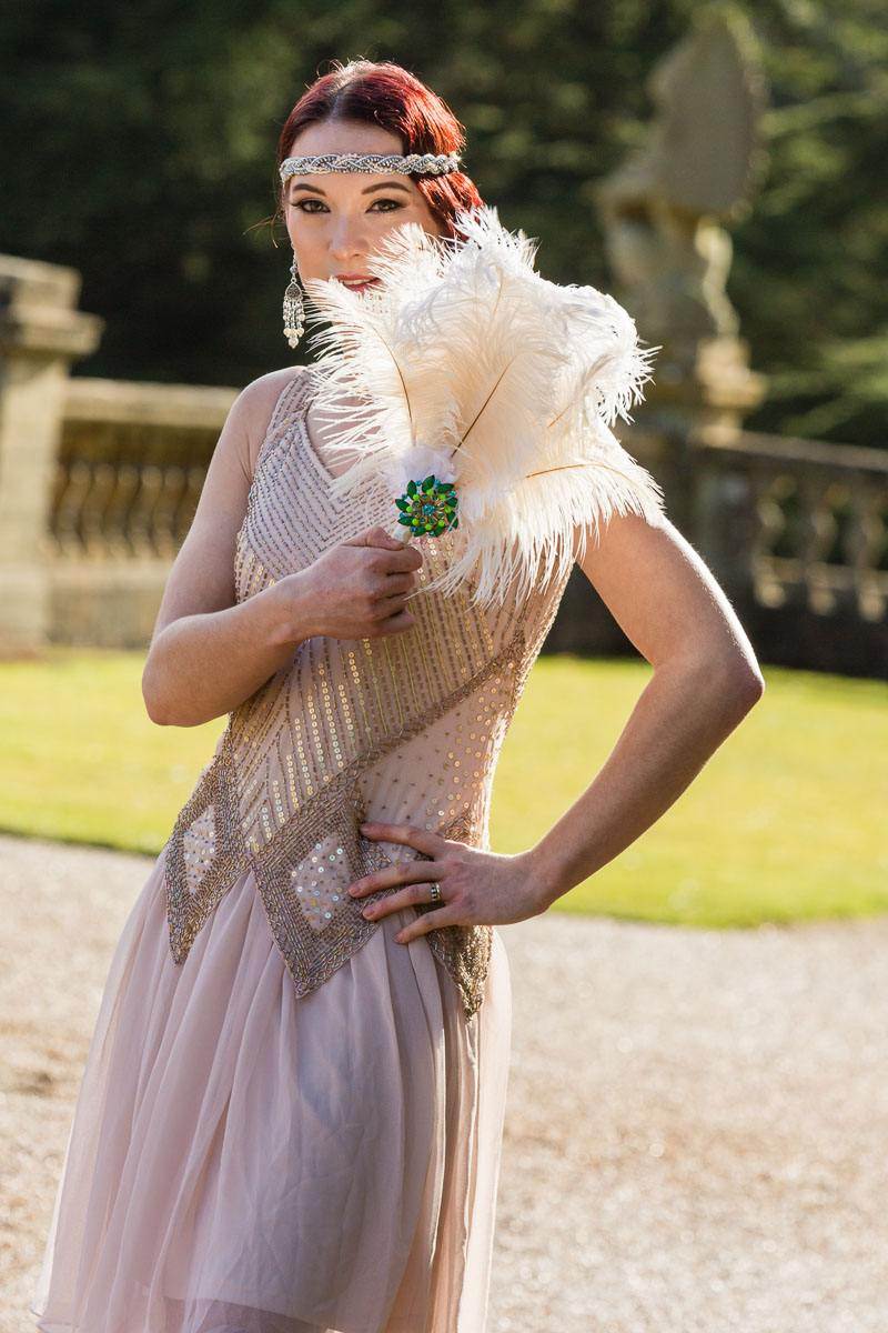 Feather Bridesmaids fan a lovely alternative to a floral bouquet.