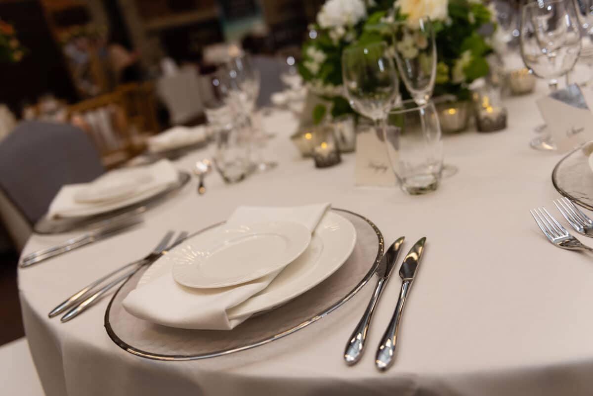 Silver rimmed charger plates  available to hire from Fabulous Functions UK